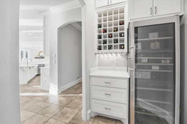 a view of walk in closet and bedroom
