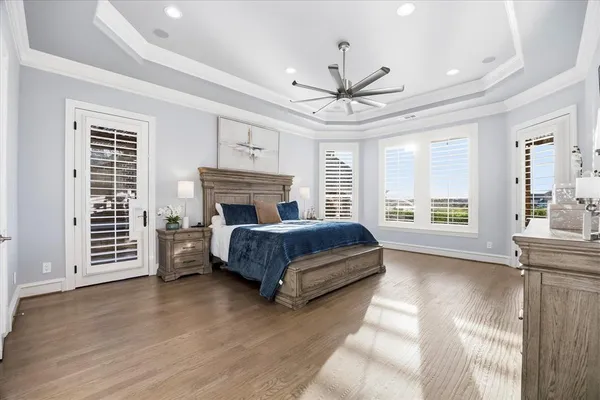 a bedroom with a bed next to a window and a fireplace