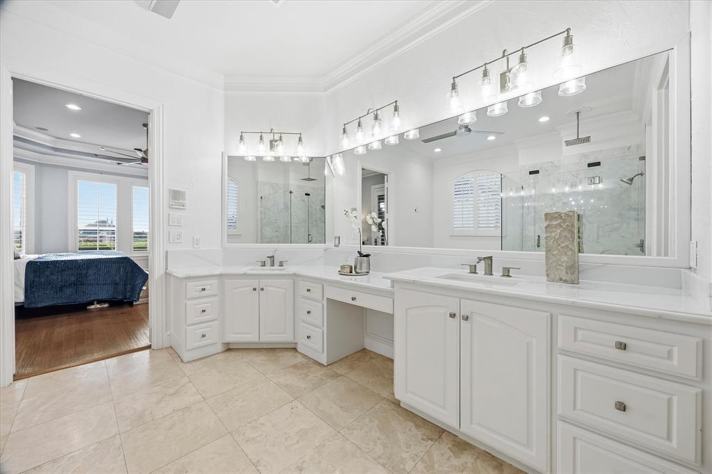 1572 Rabbit Rdg Road Heath, TX 75032 - Photo 17 of 40 a spacious bathroom with a double vanity sink mirror and bathtub