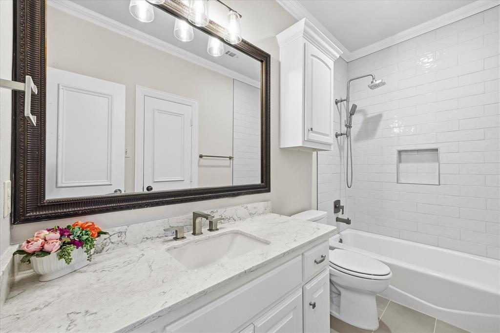 1572 Rabbit Rdg Road Heath, TX 75032 - Photo 22 of 40 a bathroom with a granite countertop sink mirror vanity and toilet