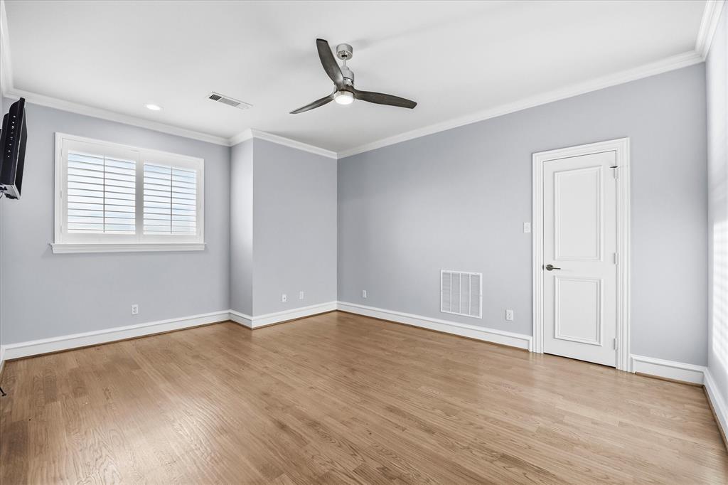 1572 Rabbit Rdg Road Heath, TX 75032 - Photo 23 of 40 a view of an empty room with wooden floor and a window