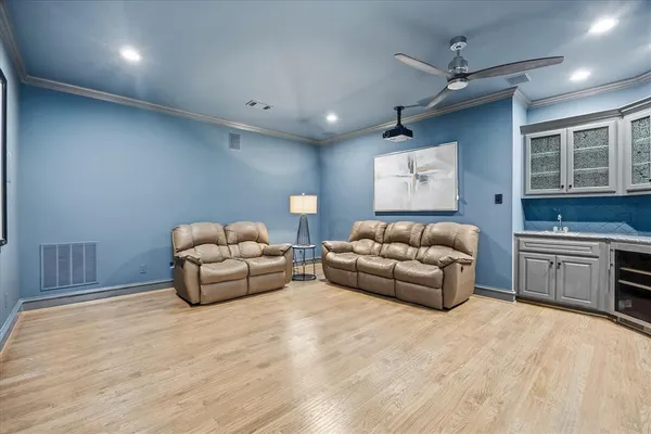 a living room with furniture and a kitchen