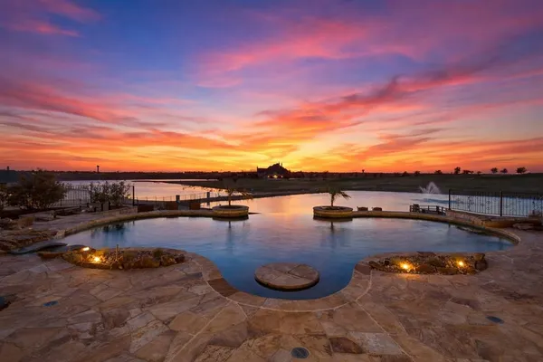 a view of a swimming pool and lounge chair