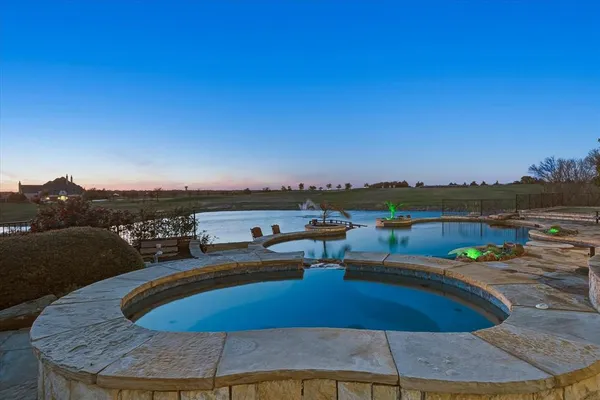 a view of a swimming pool with an ocean view