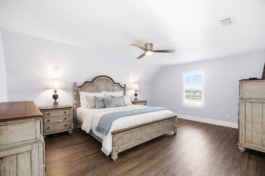 1572 Rabbit Rdg Road Heath, TX 75032 - Photo 32 of 40 a bedroom with a bed and a window