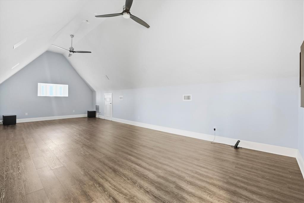 1572 Rabbit Rdg Road Heath, TX 75032 - Photo 33 of 40 an empty room with wooden floor and windows