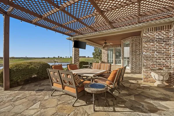 a view of a roof deck with chair and table