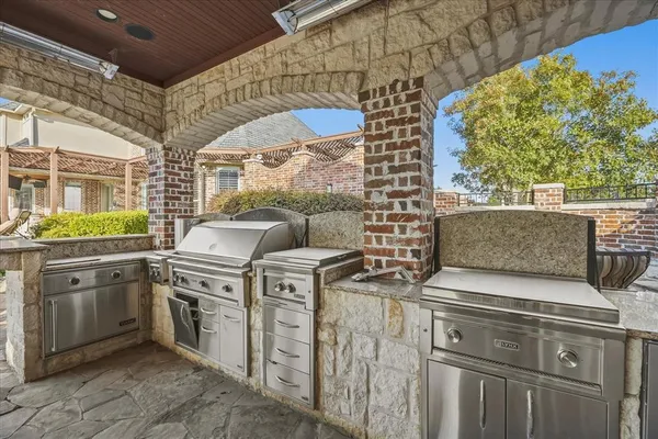 a stove top oven sitting inside of a kitchen
