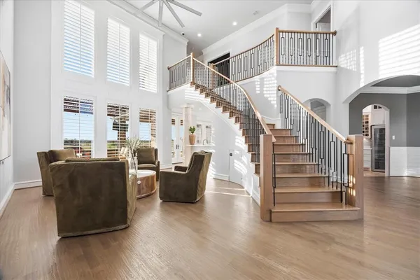 a view of entryway and hall with wooden floor