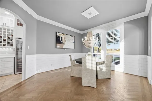 a view of a livingroom with furniture wooden floor and window