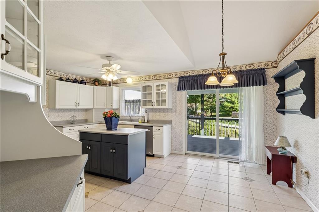 306 Country View Drive Lower Burrell, PA 15068 - Photo 11 of 50 a kitchen with stainless steel appliances granite countertop a sink and a refrigerator