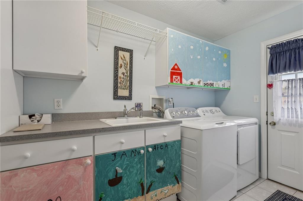 306 Country View Drive Lower Burrell, PA 15068 - Photo 17 of 50 a bathroom with a sink and a mirror