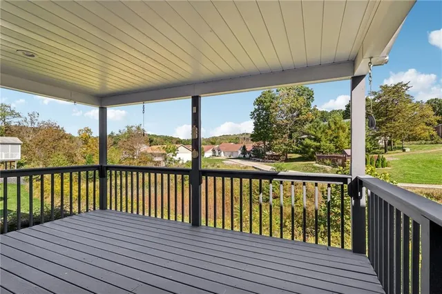 a view of balcony with wooden floor
