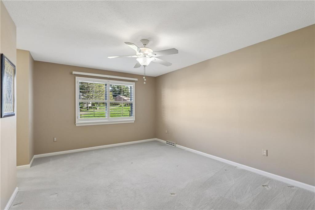 306 Country View Drive Lower Burrell, PA 15068 - Photo 20 of 50 an empty room with a window and a fan