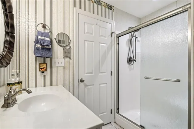a bathroom with a sink and shower