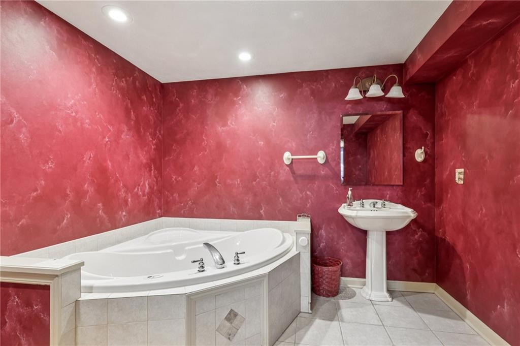 306 Country View Drive Lower Burrell, PA 15068 - Photo 35 of 50 a bathroom with a sink and a mirror