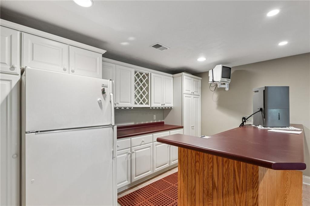 306 Country View Drive Lower Burrell, PA 15068 - Photo 37 of 50 a kitchen with refrigerator and cabinets