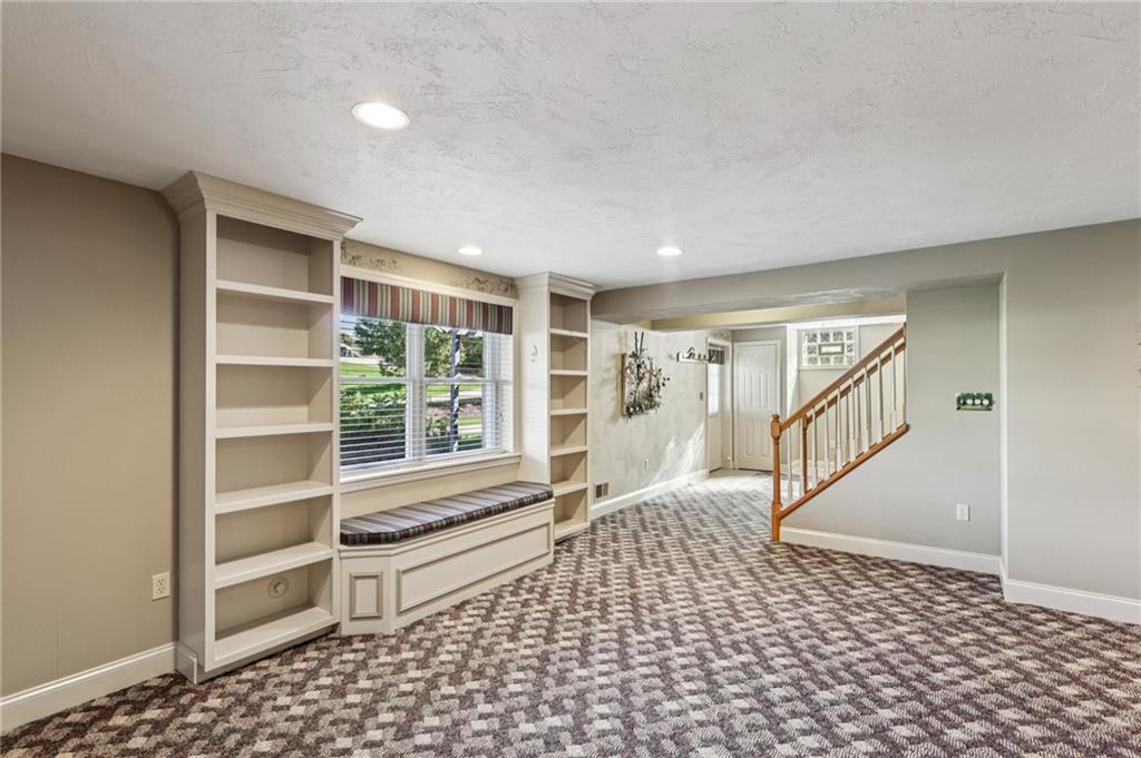 306 Country View Drive Lower Burrell, PA 15068 - Photo 39 of 50 a living room with a black white checkered floor with a large window