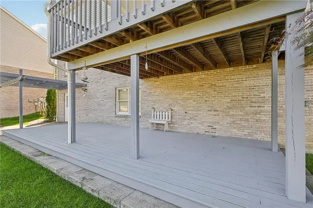 a aerial view of a house with a yard and potted plants
