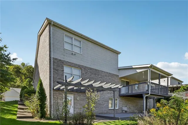 a picture of a bathroom with a white sink and a white refrigerator