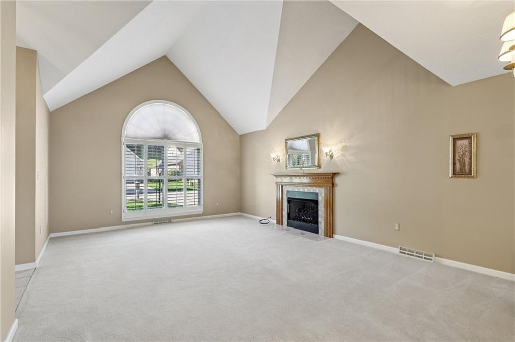 306 Country View Drive Lower Burrell, PA 15068 - Photo 6 of 50 an empty room with furniture and a fireplace