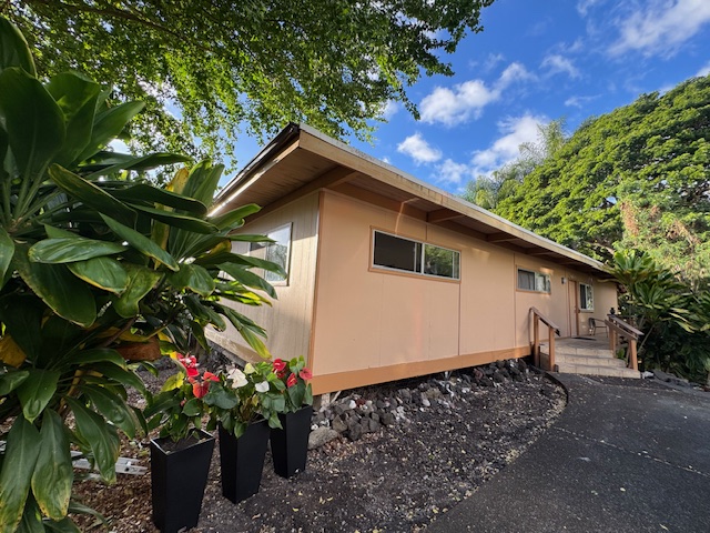 78-6745 Walua Road Kailua-Kona, HI 96740 - Photo 22 of 23 a view of a house with a flower garden