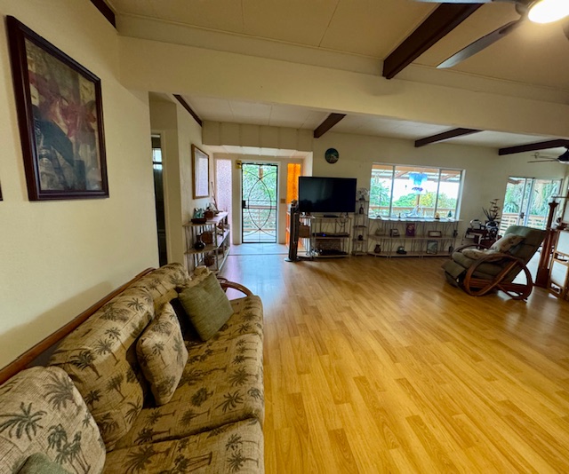 78-6745 Walua Road Kailua-Kona, HI 96740 - Photo 4 of 23 a living room with furniture and a flat screen tv