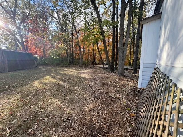 a view of outdoor space with deck and wooden floor