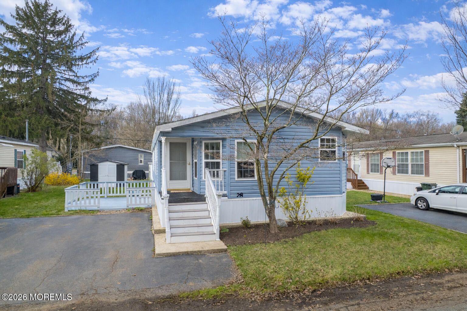 78 Village Road Morganville, NJ 07751 - Photo 20 of 25 a view of a house with a yard and garage