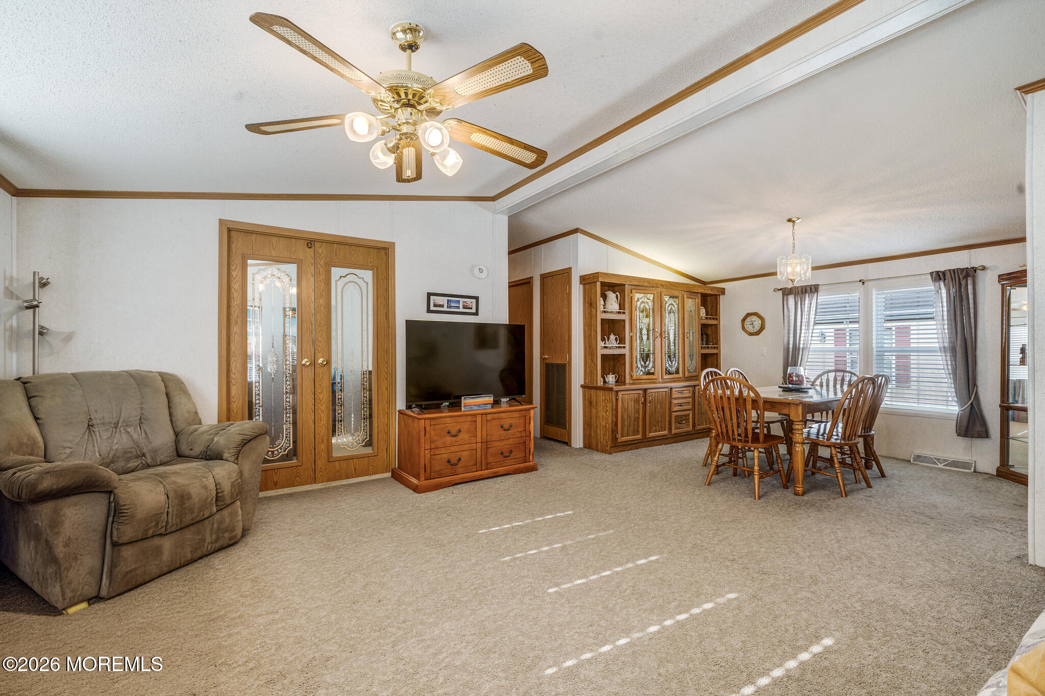 78 Village Road Morganville, NJ 07751 - Photo 4 of 25 a living room with furniture and a flat screen tv