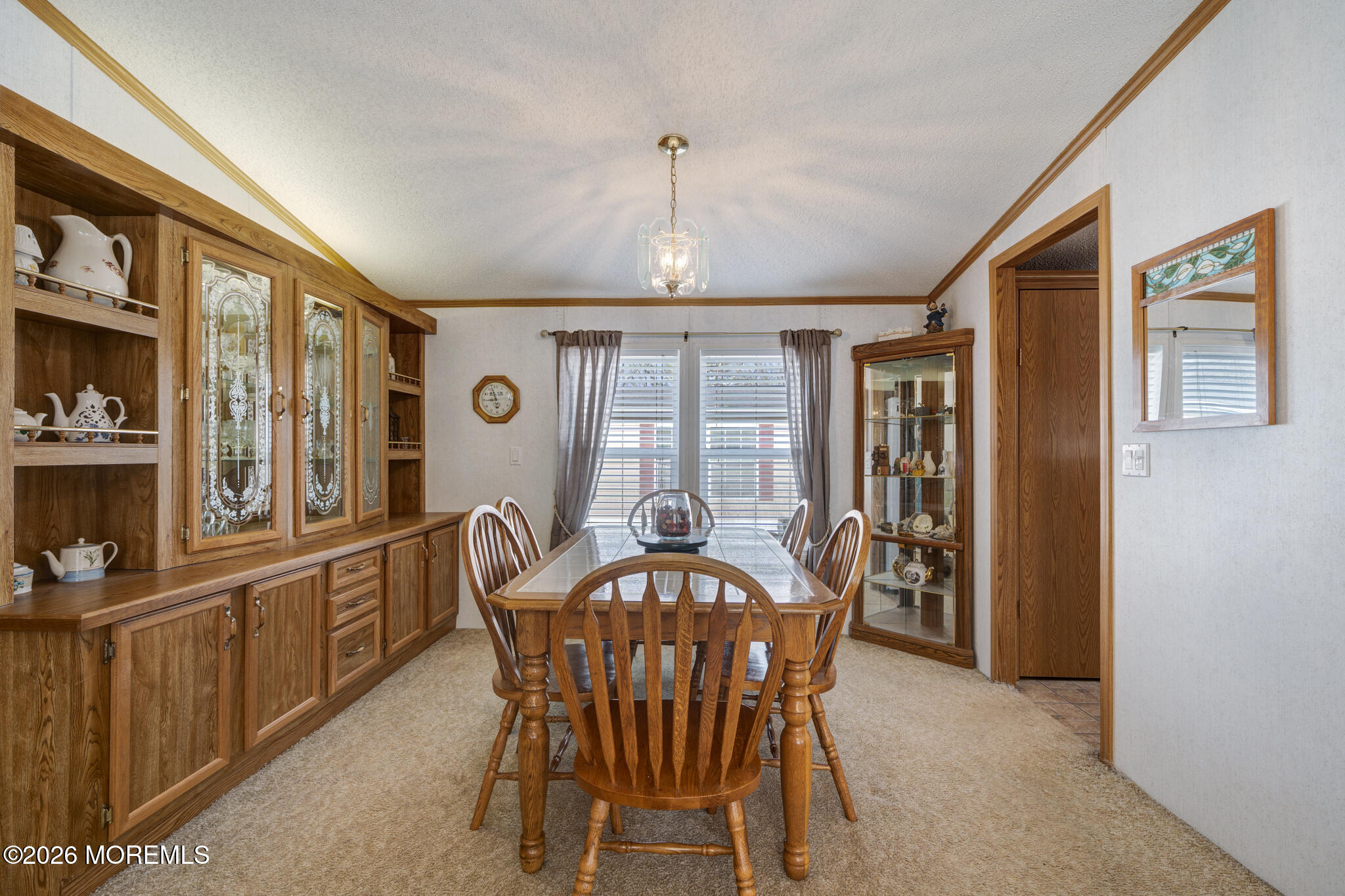 78 Village Road Morganville, NJ 07751 - Photo 7 of 25 a view of a dining room with furniture window and outside view