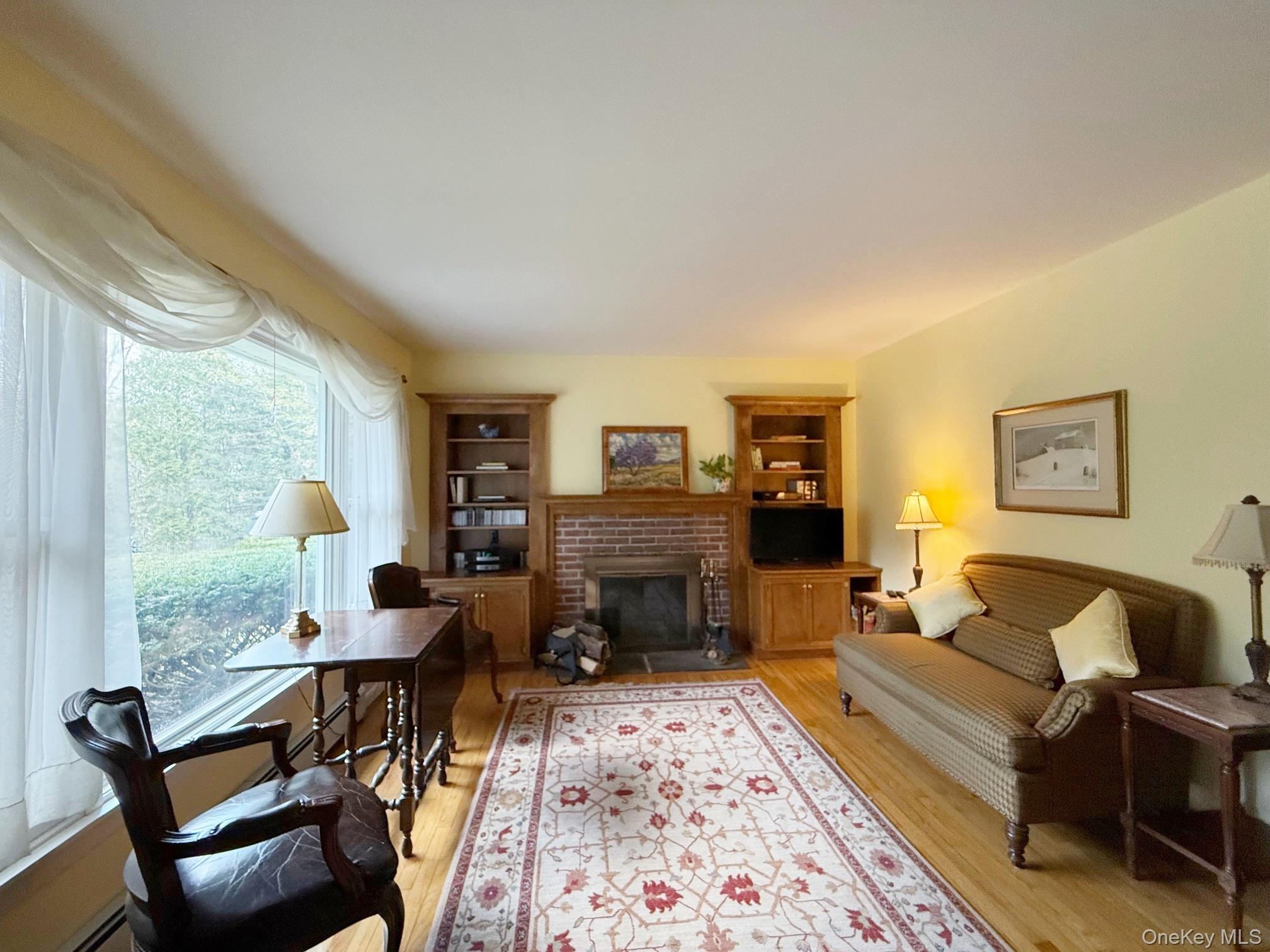 230 Cooper Road Millerton, NY 12546 - Photo 12 of 20 a living room with furniture and a fireplace