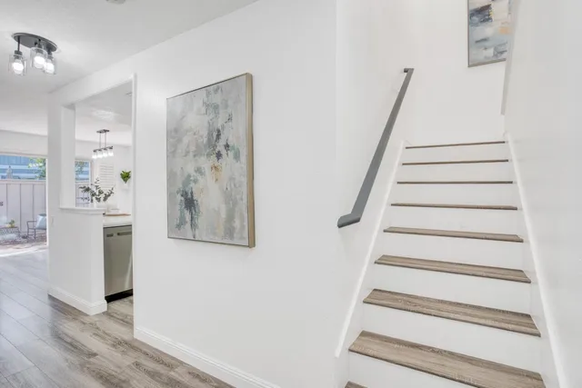 a view of entryway with furniture and wooden floor