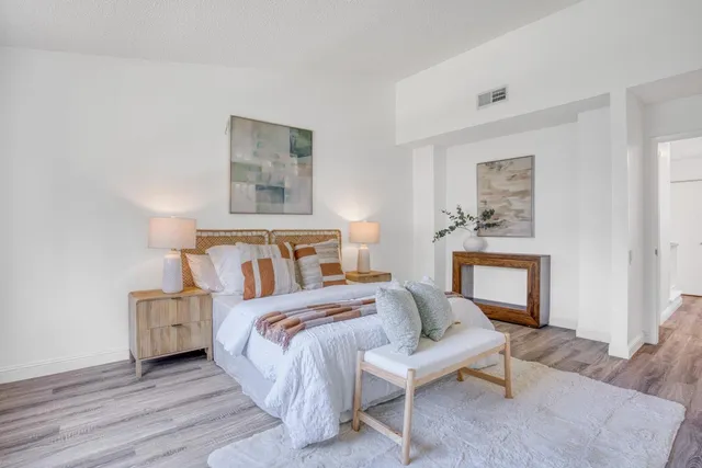 a bedroom with a bed and a couch