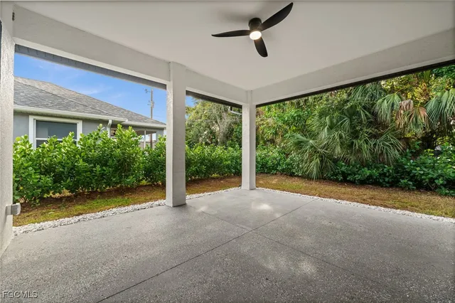 a view of a room with a big yard