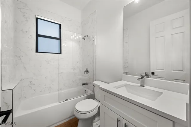 a bathroom with a sink toilet and bathtub