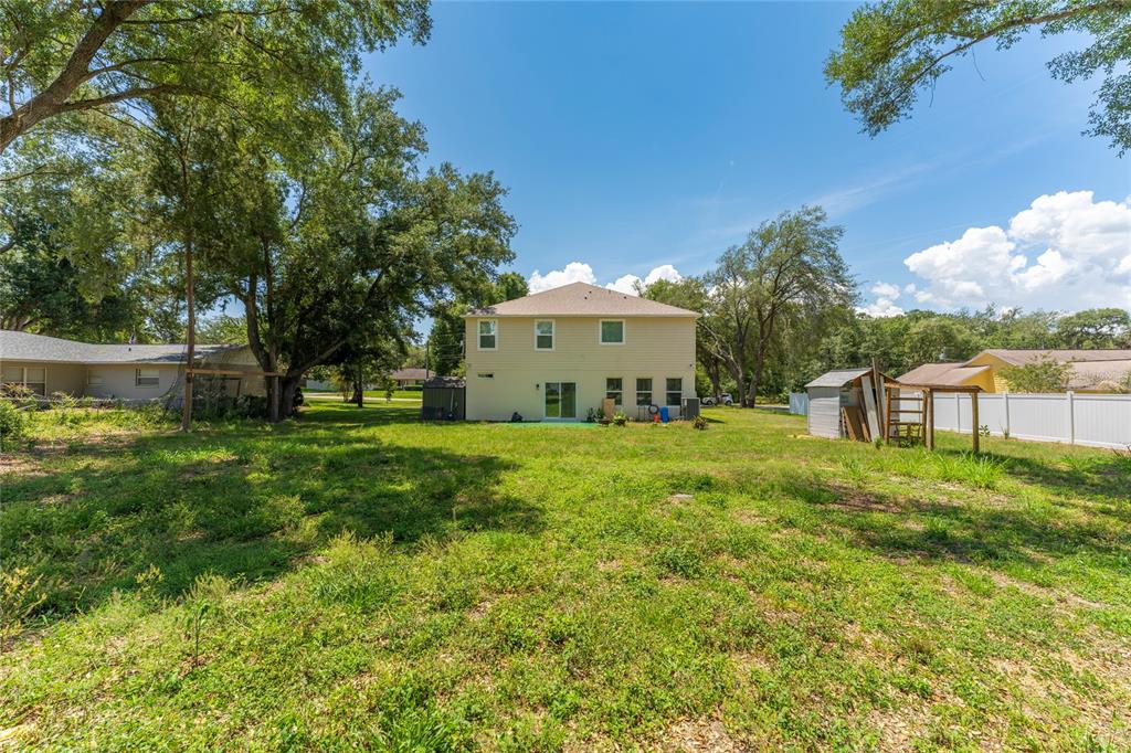 4331 Wayne Road Fruitland Park, FL 34731 - Photo 43 of 46 a front view of a house with garden