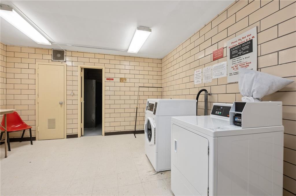 128 North Craig Street, Unit 412 Pittsburgh, PA 15213 - Photo 14 of 17 a view of storage and utility room with washer and dryer