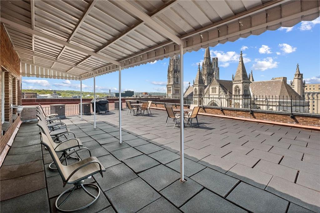 128 North Craig Street, Unit 412 Pittsburgh, PA 15213 - Photo 16 of 17 a view of a patio with table and chairs