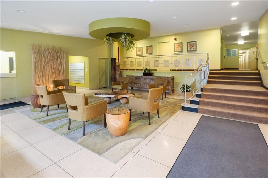 128 North Craig Street, Unit 412 Pittsburgh, PA 15213 - Photo 2 of 17 a lobby with furniture and a table