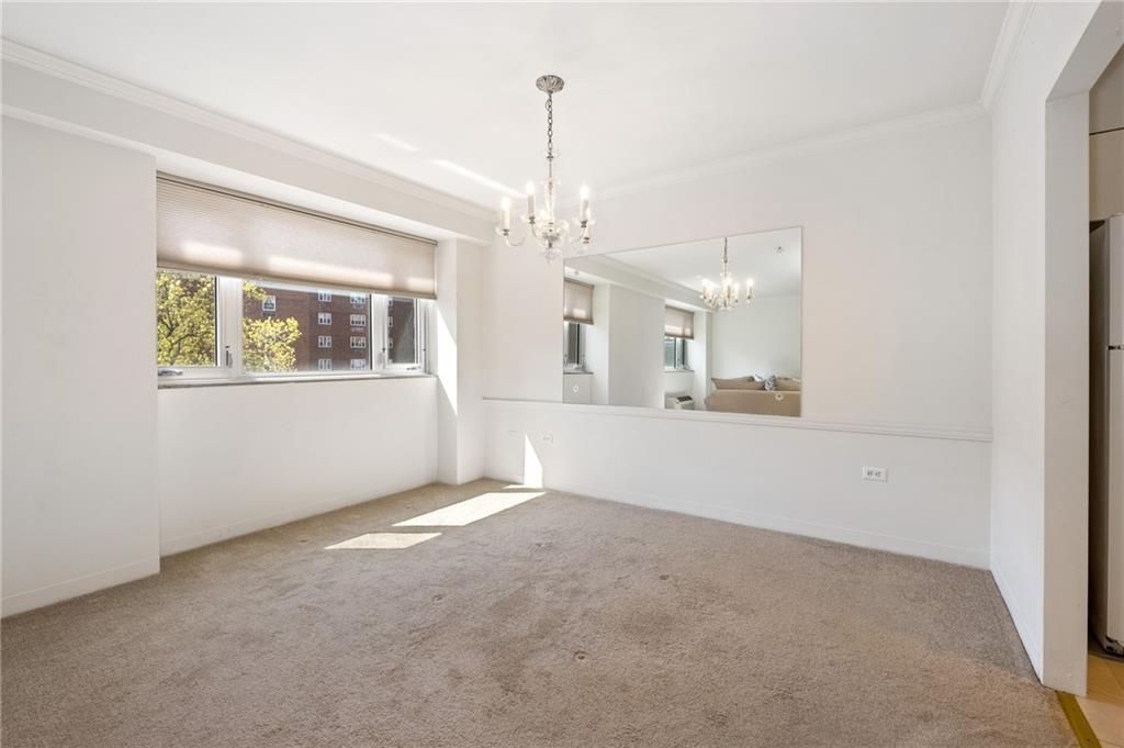 128 North Craig Street, Unit 412 Pittsburgh, PA 15213 - Photo 7 of 17 a view of a big room with windows and chandelier