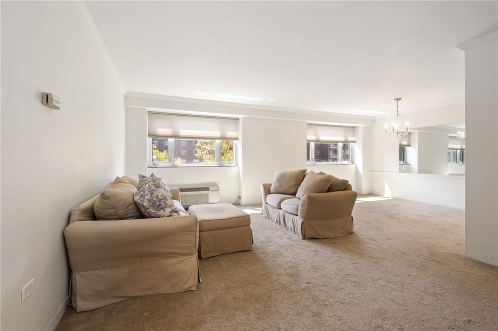 128 North Craig Street, Unit 412 Pittsburgh, PA 15213 - Photo 8 of 17 a living room with furniture and a large window