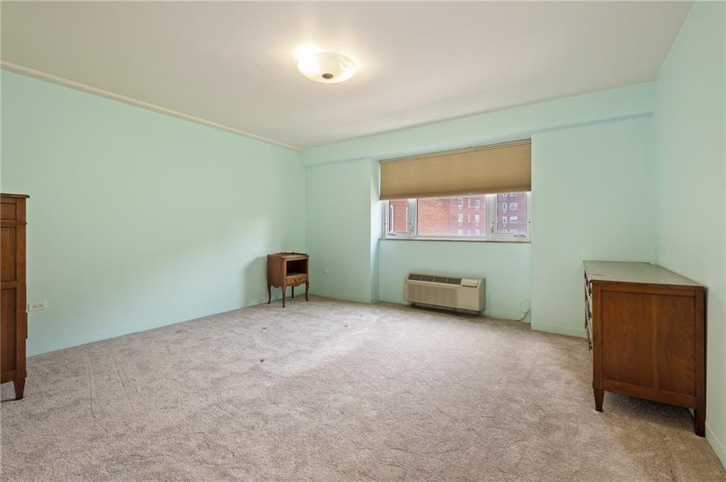 128 North Craig Street, Unit 412 Pittsburgh, PA 15213 - Photo 9 of 17 an empty room with furniture and window