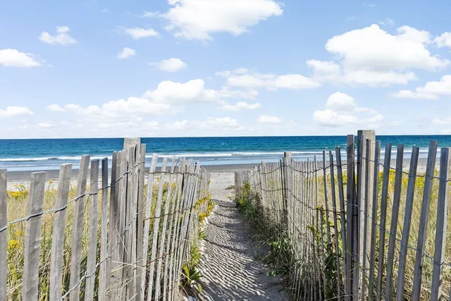 a living room with furniture fireplace and flat screen tv