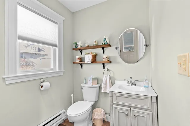 a kitchen with stainless steel appliances granite countertop table chairs stove refrigerator and cabinets