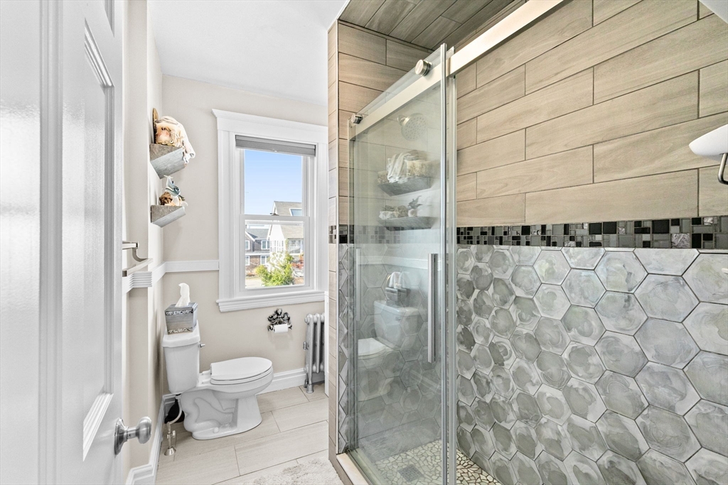 79 F Street Hull, MA 02045 - Photo 19 of 35 a bathroom with a toilet and a shower