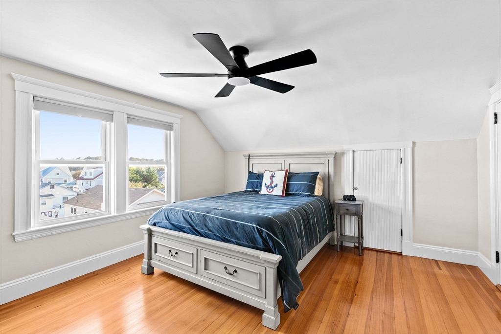 79 F Street Hull, MA 02045 - Photo 27 of 35 a bedroom with a bed and a large window