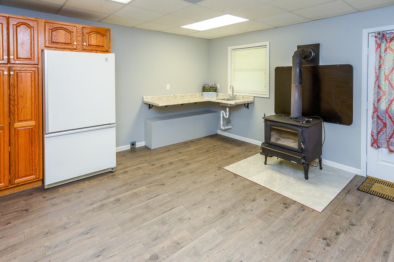 587 Damron Road Estill Springs, TN 37330 - Photo 16 of 30 Kitchenette in the finished basement has a Buck stove!