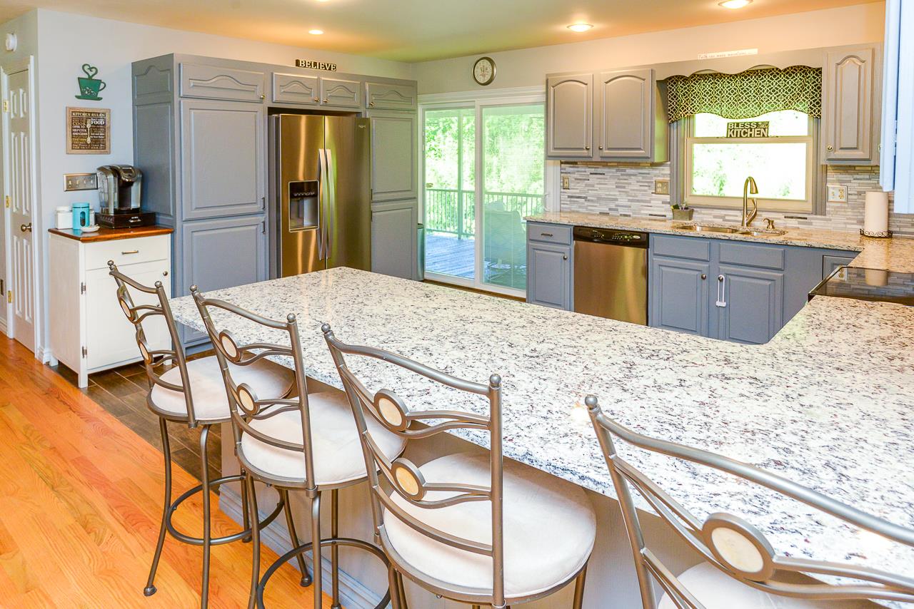 587 Damron Road Estill Springs, TN 37330 - Photo 7 of 30 Gorgeous kitchen was updated about 3 months ago with gorgeous granite counters and ceramic tile back splash!