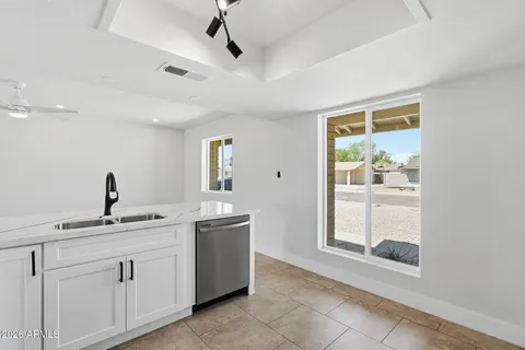 a kitchen with a sink and cabinets